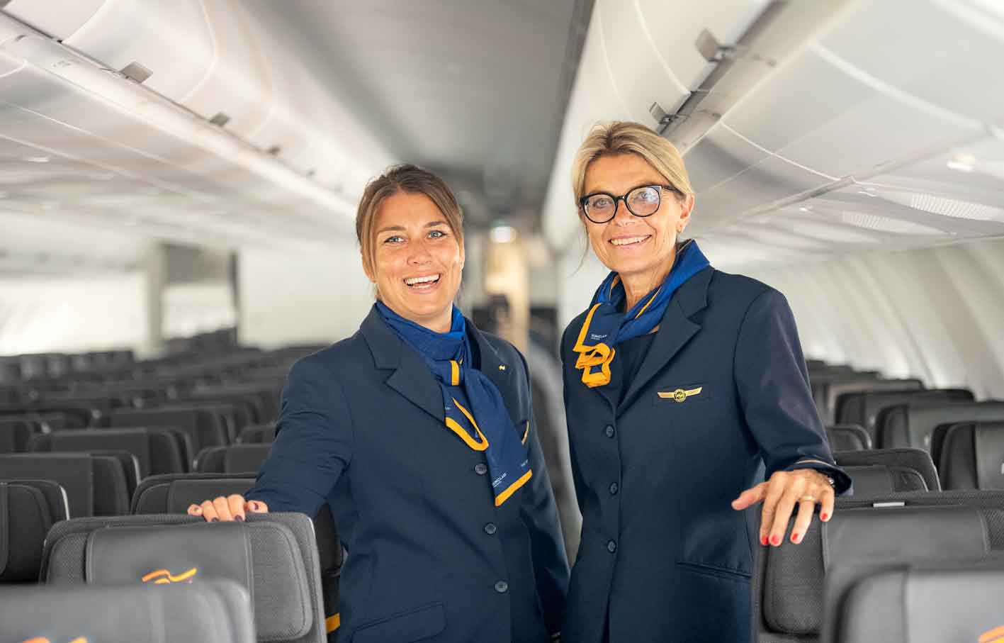 Inside the aircraft with two flight attendants